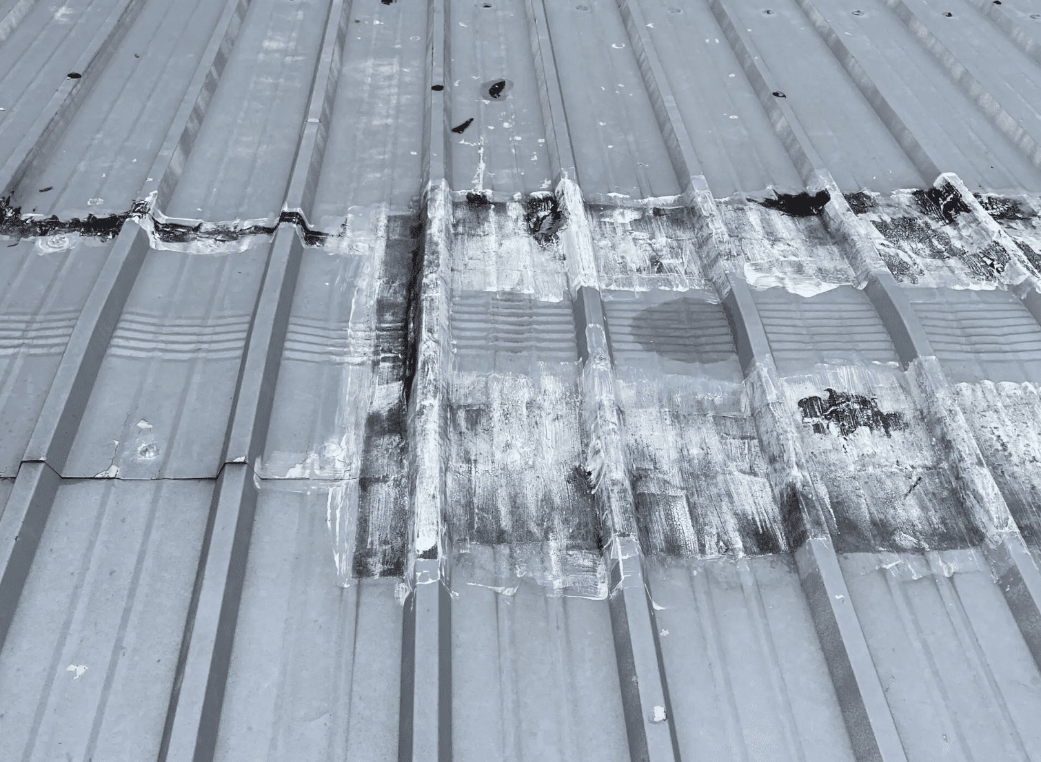 image3 Damaged metal panels on a metal commercial roof.